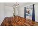 Hardwood flooring in this open concept main bedroom with sliding glass door at 6048 Tremayne Dr, Mount Dora, FL 32757