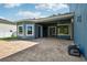 Spacious patio with an outdoor living space, ceiling fans, and paver flooring ideal for entertaining at 6048 Tremayne Dr, Mount Dora, FL 32757
