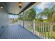 Outdoor patio with blue-painted floor and railings offers scenic views of the surrounding landscape at 6048 Tremayne Dr, Mount Dora, FL 32757