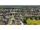 A beautiful neighborhood featuring green lawns and mature trees at 621 Lost Grove Cir, Winter Garden, FL 34787