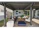 Stylishly designed covered patio with comfortable seating and decor at 621 Lost Grove Cir, Winter Garden, FL 34787