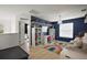 This bedroom features a rainbow carpet, overhead star lamp, and playful design elements at 621 Lost Grove Cir, Winter Garden, FL 34787