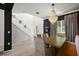 Bright and airy dining area with a modern chandelier and an open view to the staircase at 621 Lost Grove Cir, Winter Garden, FL 34787