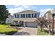 Charming two-story home with manicured lawn and a brick driveway at 621 Lost Grove Cir, Winter Garden, FL 34787