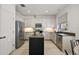 Open kitchen features granite countertops, stainless appliances, and ample cabinet space at 621 Lost Grove Cir, Winter Garden, FL 34787