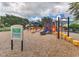 Community playground featuring colorful play structures and a safety surface at 621 Lost Grove Cir, Winter Garden, FL 34787