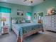 Serene bedroom with calming colors, decorative pillows, and natural light at 627 Timbercrest Dr, Leesburg, FL 34748