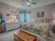 Cozy bedroom featuring a decorative bed, wooden chest, and soft lighting at 627 Timbercrest Dr, Leesburg, FL 34748