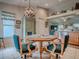 Bright eat-in kitchen featuring stainless appliances, granite countertops, and wooden cabinets at 627 Timbercrest Dr, Leesburg, FL 34748