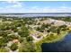 Breathtaking aerial view of a charming neighborhood near a lake, surrounded by trees at 628 Drew Ave, Clermont, FL 34711