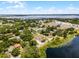 Stunning aerial view of a lakeside community with lush greenery and beautiful lake views at 628 Drew Ave, Clermont, FL 34711