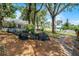 Spacious backyard with a unique pet tunnel area and a charming gravel pathway at 628 Drew Ave, Clermont, FL 34711