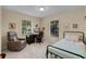 Comfortable bedroom features natural light and relaxing seating at 628 Drew Ave, Clermont, FL 34711