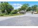 Charming two-story home with a circular driveway, mature trees, and well-manicured lawn at 628 Drew Ave, Clermont, FL 34711