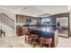 Modern kitchen with granite countertops, stainless steel appliances, and a center island with seating at 628 Drew Ave, Clermont, FL 34711
