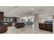 Spacious kitchen featuring a large island, stainless steel appliances, and adjacent dining area at 628 Drew Ave, Clermont, FL 34711