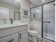 Modern bathroom with a sleek vanity, updated fixtures, and a glass-enclosed shower at 6295 Danielson Loop, The Villages, FL 32163