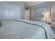 The lovely bedroom boasts wood-look floors, neutral paint, lots of natural light, and large closet at 6295 Danielson Loop, The Villages, FL 32163