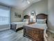 Cozy bedroom featuring two twin beds, wood-look floors, and a serene color palette at 6295 Danielson Loop, The Villages, FL 32163