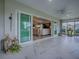 Spacious lanai with sliding glass doors leading to a beautifully furnished living room at 6295 Danielson Loop, The Villages, FL 32163