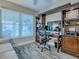 Office space featuring built-in shelving, desk, and a window with a view at 6295 Danielson Loop, The Villages, FL 32163