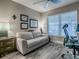 Comfortable office area with a white sofa, desk, and a window for natural light at 6295 Danielson Loop, The Villages, FL 32163