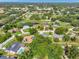 Aerial view of a golf community with a pond, green space and homes at 6829 Bittersweet Ln, Orlando, FL 32819