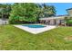 This home offers a beautiful pool, lovely patio and green grass in its spacious backyard at 6829 Bittersweet Ln, Orlando, FL 32819