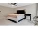 Bedroom featuring plush carpet, ceiling fan and a black accent wall at 6829 Bittersweet Ln, Orlando, FL 32819
