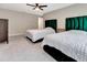 Bedroom with two beds, soft carpet, and a ceiling fan at 6829 Bittersweet Ln, Orlando, FL 32819