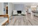 Bright living room with modern fireplace, decorative wall and wood-look flooring at 6829 Bittersweet Ln, Orlando, FL 32819