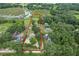Aerial view showcasing property boundaries and home location within a wooded area at 8634 Garden Way Rd, Groveland, FL 34736