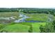 Expansive landscape showcasing the lake and verdant landscape surrounding the property at 8634 Garden Way Rd, Groveland, FL 34736