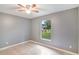 Bedroom with natural light and a view to the outdoors at 8634 Garden Way Rd, Groveland, FL 34736