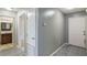 Hallway view showcases the bathroom, linen closet, and access to the backyard at 8634 Garden Way Rd, Groveland, FL 34736
