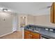 Kitchen area featuring stainless appliances, breakfast bar and tile flooring at 8634 Garden Way Rd, Groveland, FL 34736