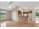 Open-concept kitchen with tile flooring and ample counter space at 8634 Garden Way Rd, Groveland, FL 34736