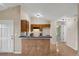Open kitchen layout with a breakfast bar and tile flooring at 8634 Garden Way Rd, Groveland, FL 34736