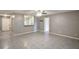 View of the living room featuring gray walls and tiled floors at 8634 Garden Way Rd, Groveland, FL 34736
