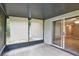 Enjoy outdoor living on this screened-in patio with tile floor and sliding door access to the house at 8634 Garden Way Rd, Groveland, FL 34736