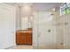 Elegant bathroom featuring frameless shower, vanity, and tile floor, creating a clean and refreshing atmosphere at 9433 San Miguel, Howey In The Hills, FL 34737