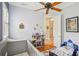 A bedroom with hardwood floors, toys, a crib and neutral walls at 9433 San Miguel, Howey In The Hills, FL 34737