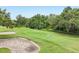 Scenic view of the well-maintained green golf course with sand trap at 9433 San Miguel, Howey In The Hills, FL 34737