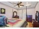 Inviting bedroom featuring a four-poster bed, tray ceilings, and elegant furnishings for a peaceful retreat at 9433 San Miguel, Howey In The Hills, FL 34737