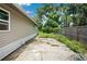 Backyard of house with foliage and partial fence line at 1134 Cr 464, Lake Panasoffkee, FL 33538