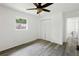 The bright bedroom has a closet and window at 1134 Cr 464, Lake Panasoffkee, FL 33538