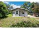 Exterior showcasing the home's facade, yard, and residential charm at 1134 Cr 464, Lake Panasoffkee, FL 33538