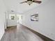 Spacious living room with new wood-look floors and ceiling fan at 1134 Cr 464, Lake Panasoffkee, FL 33538