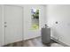 Utility room features new flooring and a door to the exterior at 1134 Cr 464, Lake Panasoffkee, FL 33538