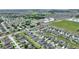 Expansive aerial shot highlighting a well-planned neighborhood with the property marked by a red pin at 120 Citrus Isle St, Davenport, FL 33837